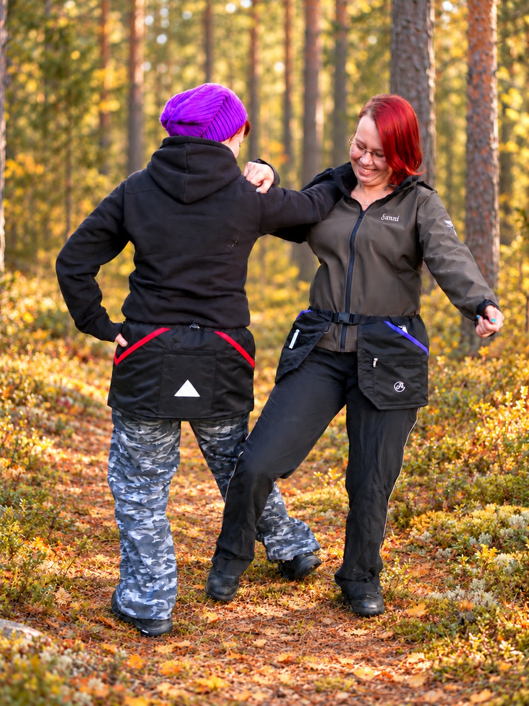 Dog handlers wearing HelsiTar training pockets